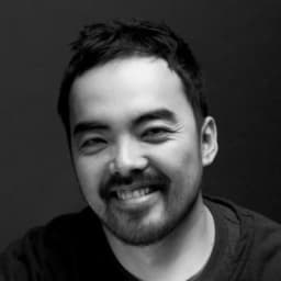 A black-and-white photo of Light Phone creator Kai Tang.